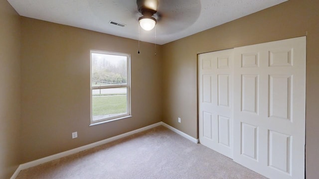 304 Brentwood Dr, Dry Ridge, KY 41035 - unfurnished bedroom with light colored carpet, a closet, baseboards, and ceiling fan