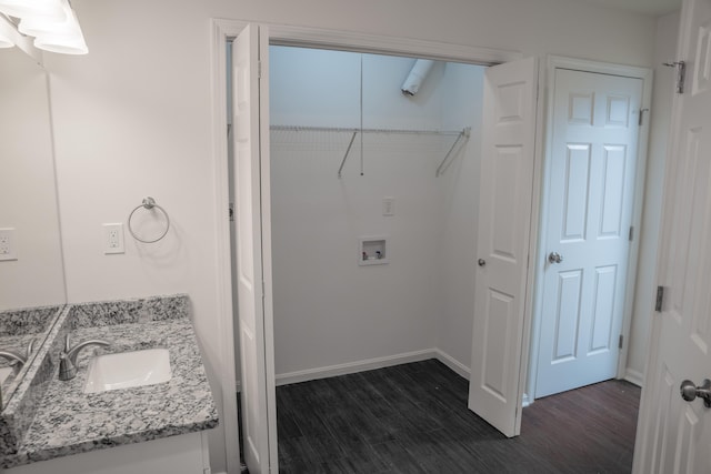 bathroom featuring hardwood / wood-style flooring and vanity