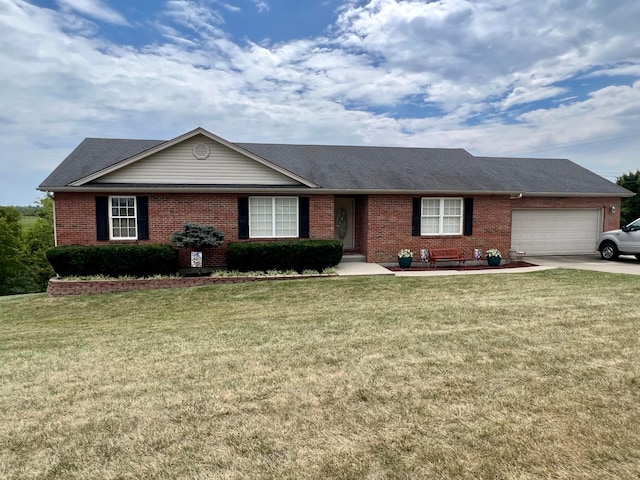 ranch-style home with a garage and a front lawn