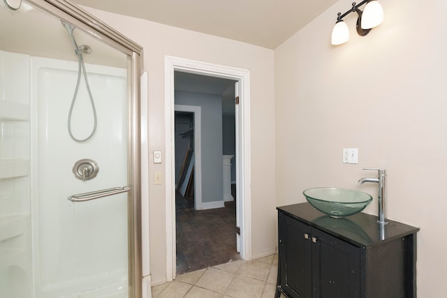 bathroom featuring a shower, vanity, and wood-type flooring