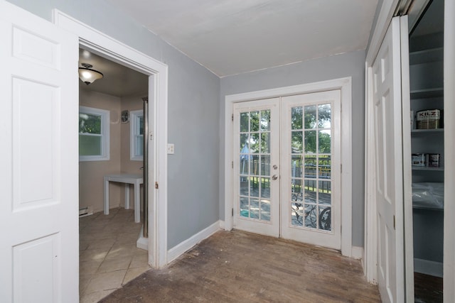 doorway featuring hardwood / wood-style flooring, french doors, and baseboard heating