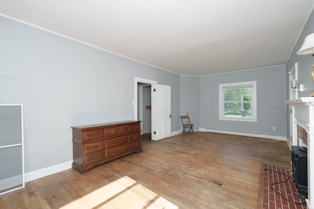 living room featuring light hardwood / wood-style flooring and baseboard heating