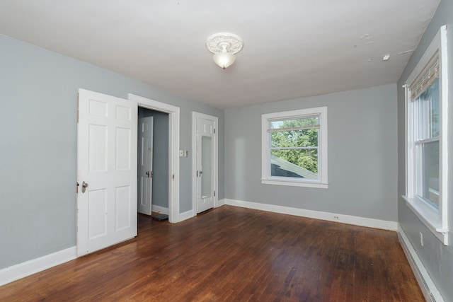 unfurnished bedroom with hardwood / wood-style floors