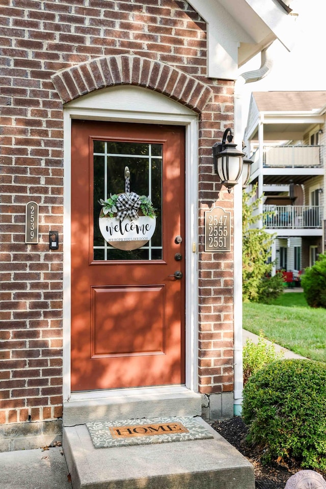 doorway to property featuring a balcony