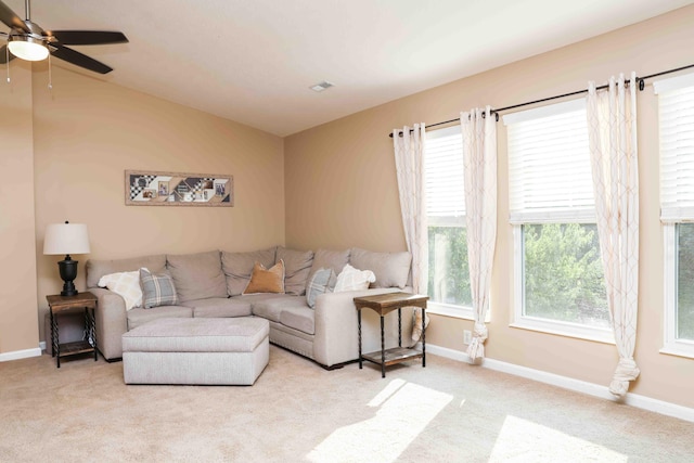 carpeted living room featuring ceiling fan