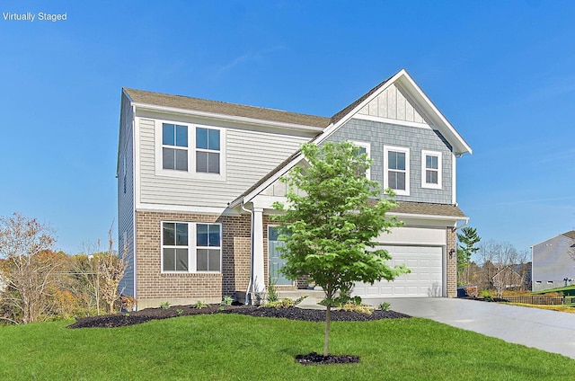 view of front of property with a front yard and a garage