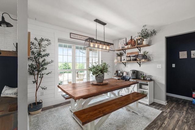 dining room with dark wood-style floors and baseboards