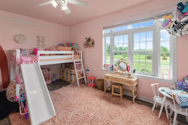 bedroom with baseboards and crown molding