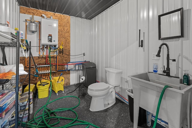 bathroom featuring water heater and a sink