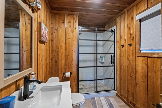 bathroom with toilet, a shower with door, wood walls, sink, and wood ceiling