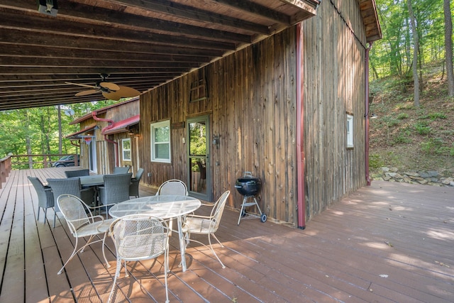 wooden deck featuring a grill and ceiling fan