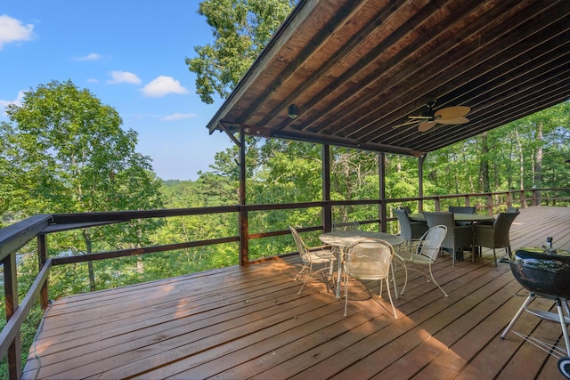 wooden terrace featuring ceiling fan