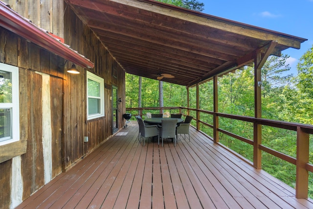 wooden deck featuring ceiling fan