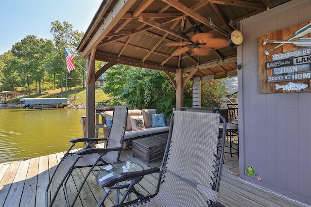 exterior space featuring a gazebo and a water view