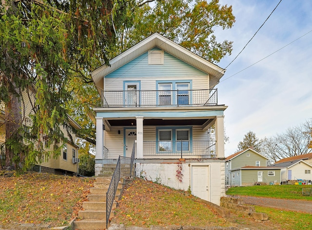 view of front of house featuring a porch and a garage