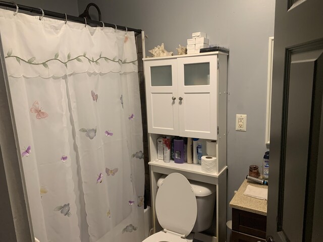 full bathroom featuring vanity, toilet, and shower / tub combo