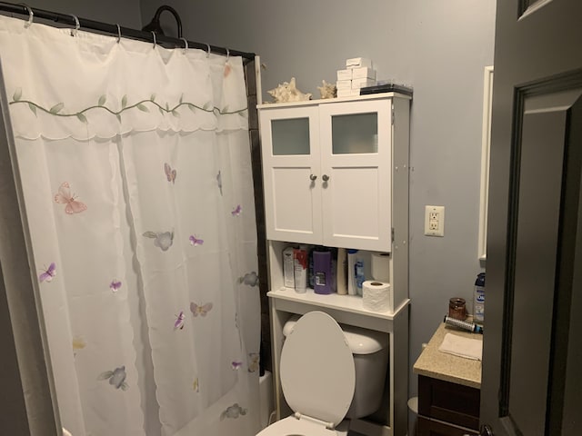 bathroom with shower / bath combination with curtain and toilet