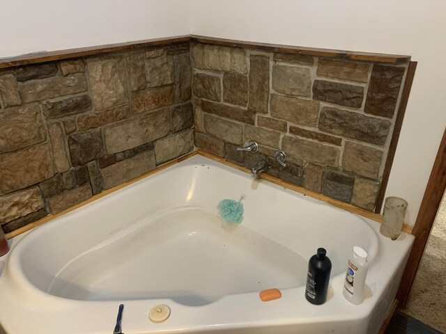 bathroom featuring a washtub