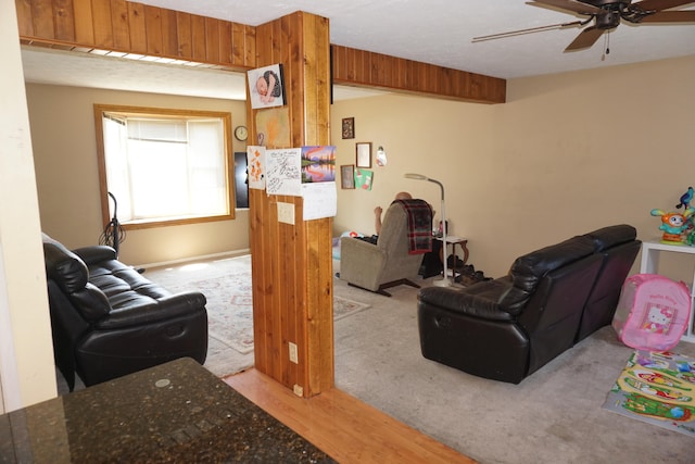 living room featuring light wood-type flooring and ceiling fan