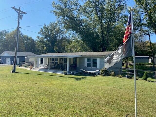 back of house featuring a yard