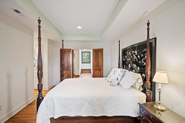 bedroom featuring wood-type flooring