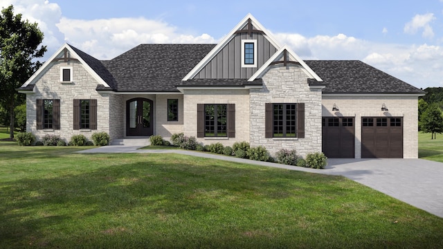 view of front of house with a front yard and a garage