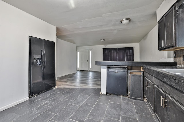 kitchen featuring black appliances and dark hardwood / wood-style floors