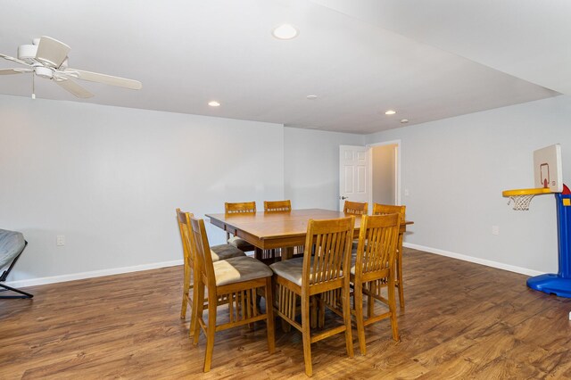 dining space featuring ceiling fan and dark hardwood / wood-style flooring