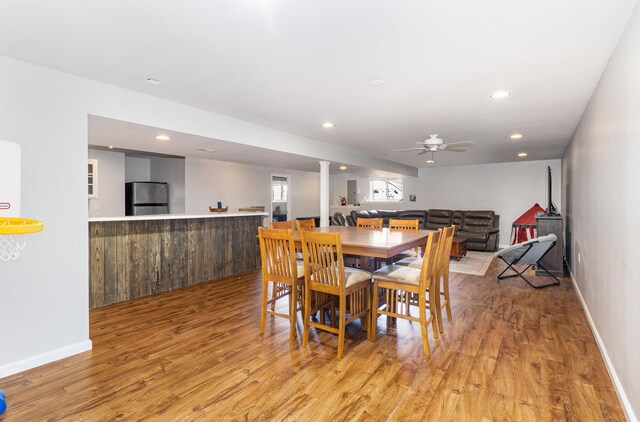 dining area featuring light hardwood / wood-style flooring and ceiling fan