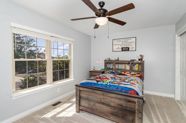 carpeted bedroom featuring ceiling fan