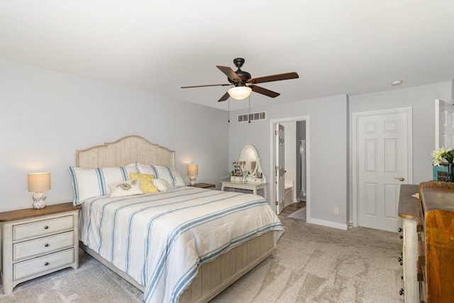 carpeted bedroom featuring ceiling fan and connected bathroom