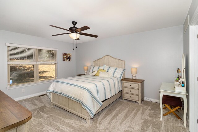 bedroom with light colored carpet and ceiling fan