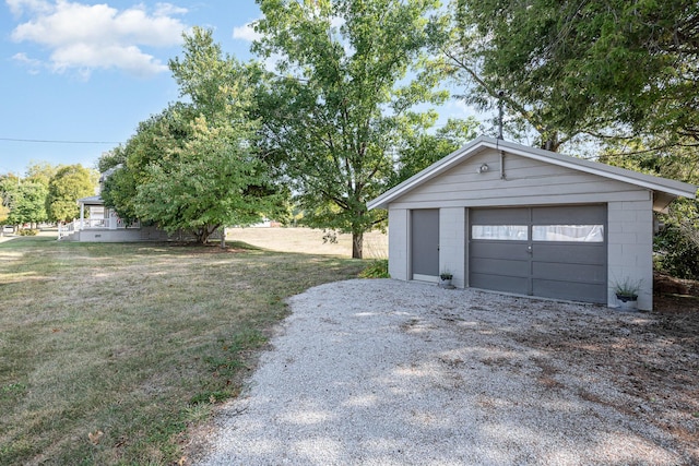 detached garage featuring driveway