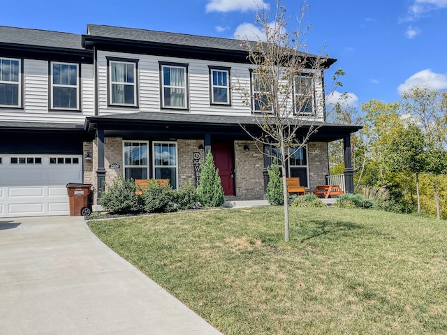 view of front of property with a front lawn, a porch, and a garage