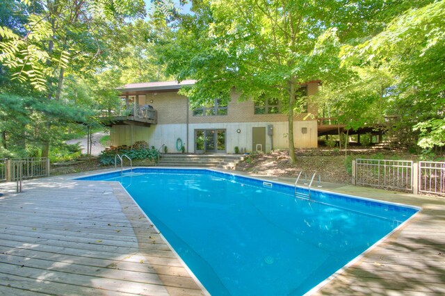 view of pool with a wooden deck