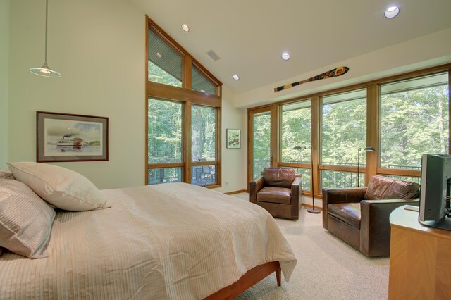 bedroom with light carpet and high vaulted ceiling