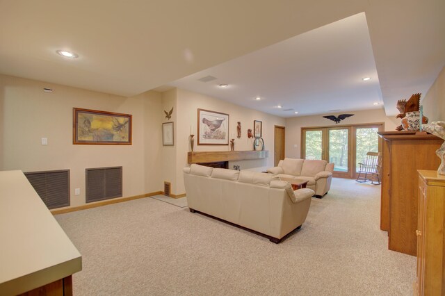 living room featuring light colored carpet