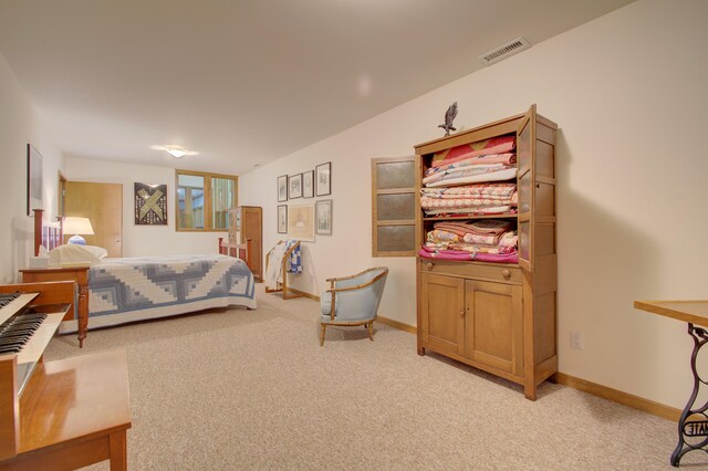 bedroom featuring lofted ceiling and light colored carpet