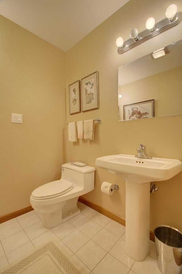 bathroom featuring toilet and tile patterned floors