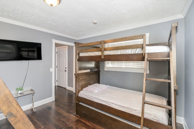 bedroom featuring ornamental molding, dark wood-type flooring, and a textured ceiling