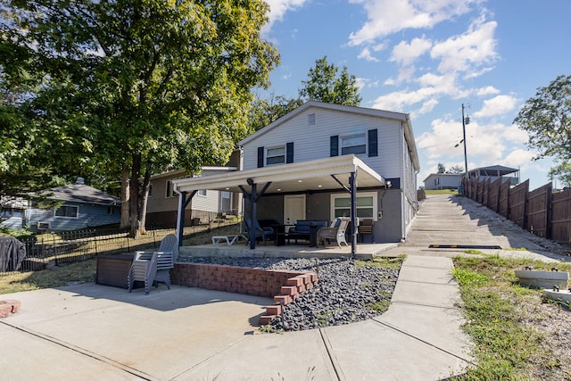 rear view of house featuring a patio