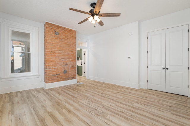 unfurnished bedroom featuring ceiling fan, a closet, and light hardwood / wood-style floors