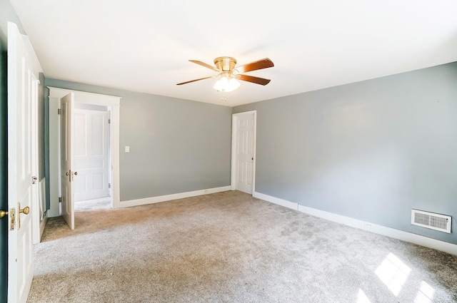 unfurnished bedroom with ceiling fan and light colored carpet