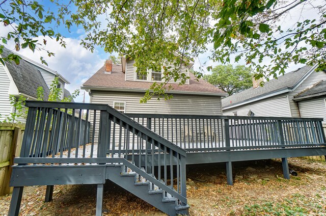 rear view of house with a wooden deck