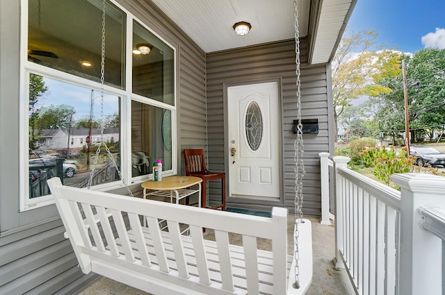 entrance to property featuring covered porch