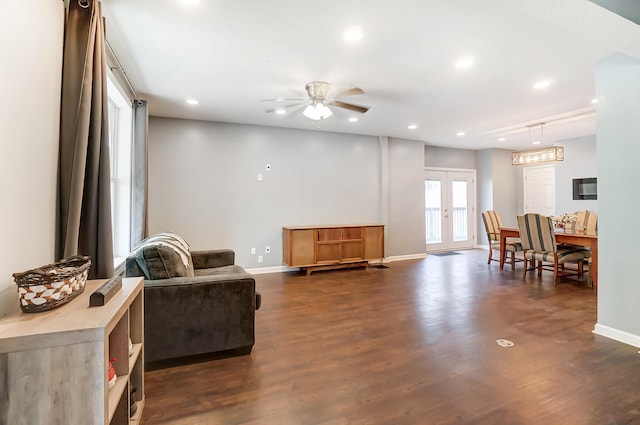 sitting room with rail lighting, ceiling fan, dark hardwood / wood-style floors, and french doors