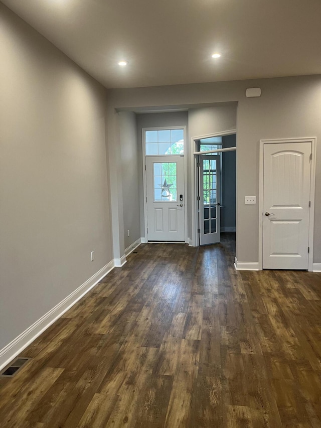 spare room with dark hardwood / wood-style flooring