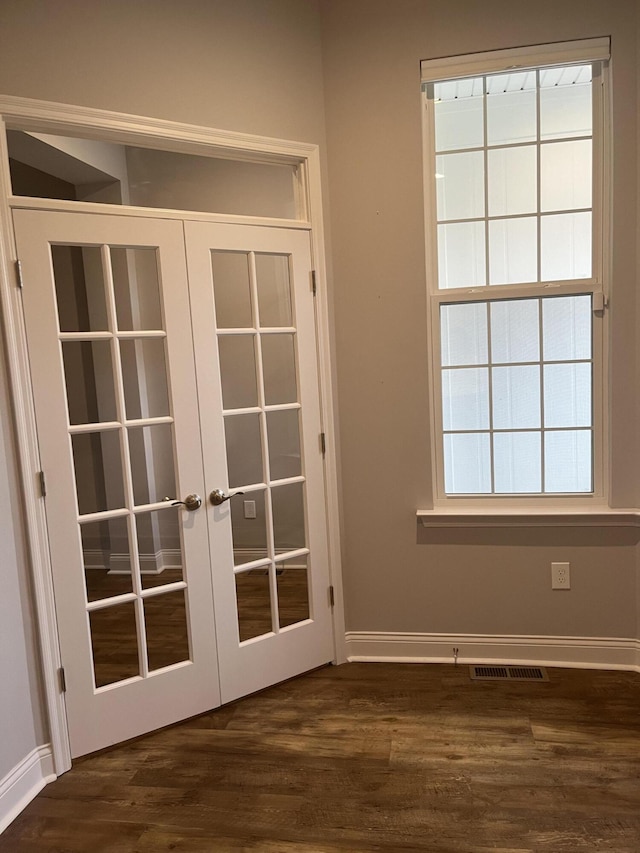 doorway featuring french doors and dark hardwood / wood-style flooring