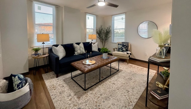 living room featuring a healthy amount of sunlight, ceiling fan, and hardwood / wood-style floors