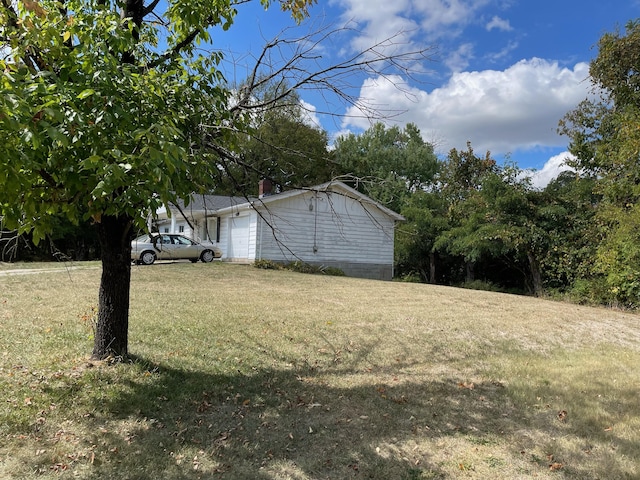 view of yard with a garage